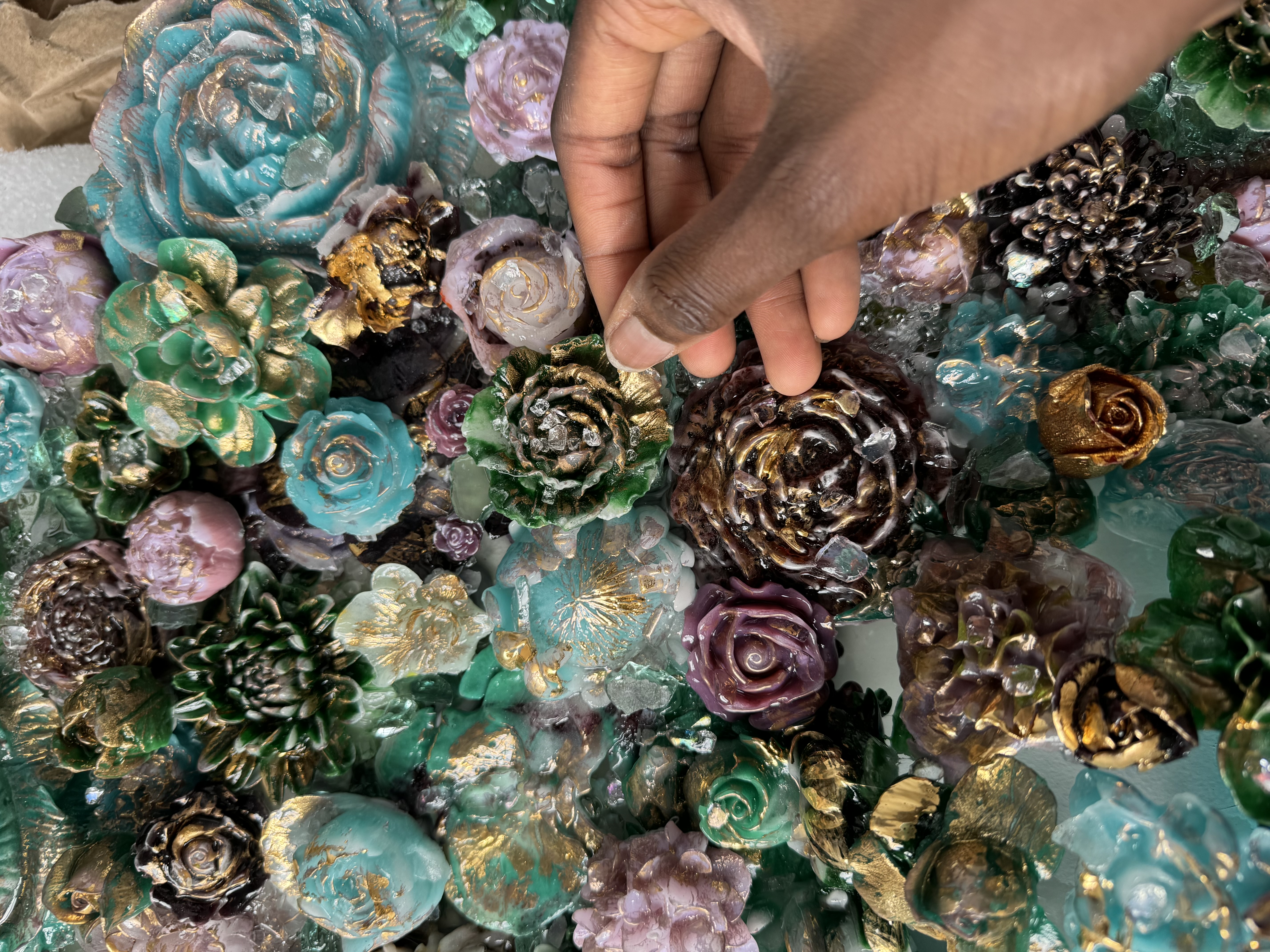 Teal and gold floral sculpture arrangement